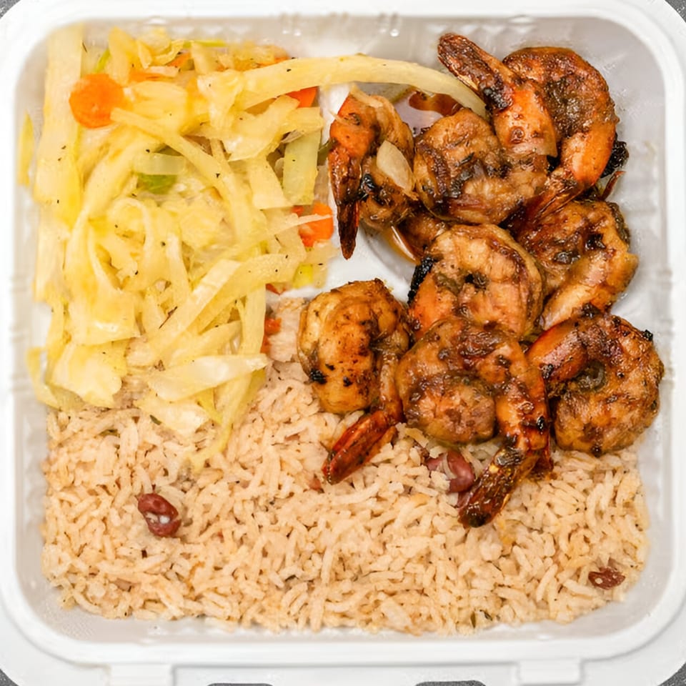 My Place Jamaica Way Restaurant's jerk shrimp with rice and peas, and steamed cabbage.